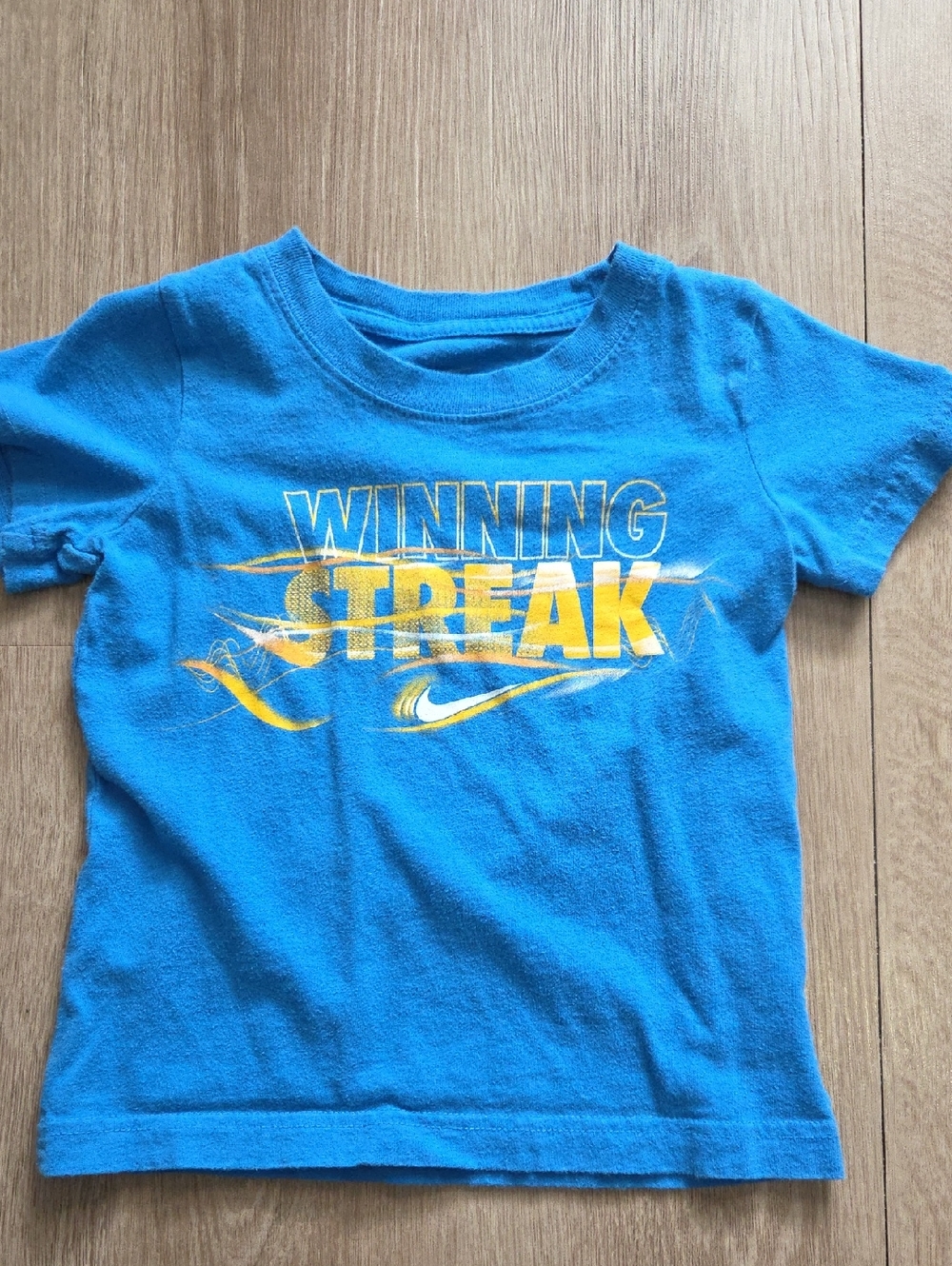 Nike Blue Tee with Yellow "Winning Streak" Graphic
